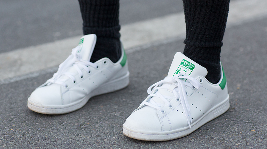 woman wearing adidas stan smith shoes