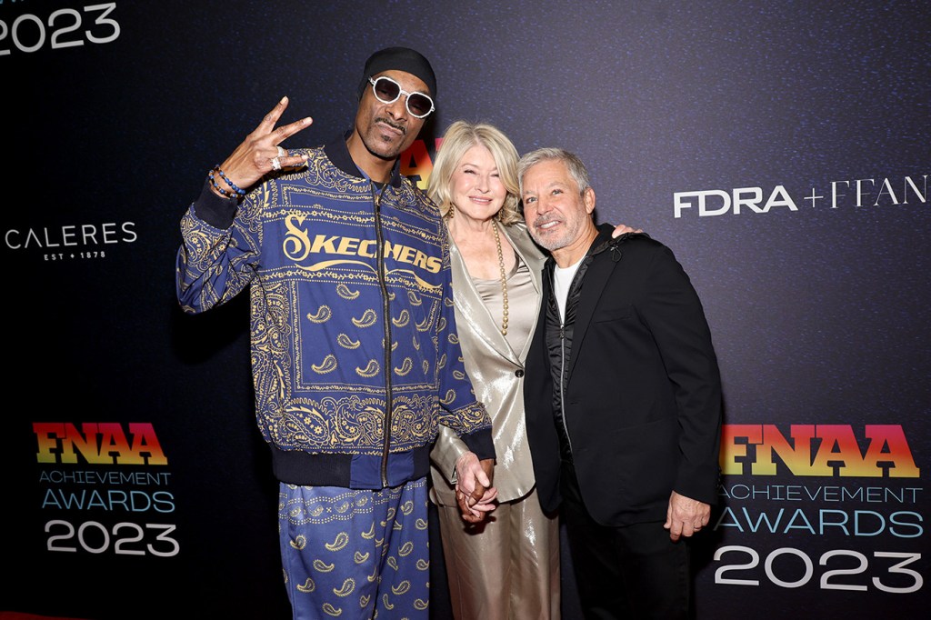 NEW YORK, NEW YORK - NOVEMBER 29: (L-R) Snoop Dogg, Martha Stewart, and Michael Greenberg attend the 2023 Footwear News Achievement Awards at Cipriani South Street on November 29, 2023 in New York City. (Photo by Jamie McCarthy/Footwear News via Getty Images)