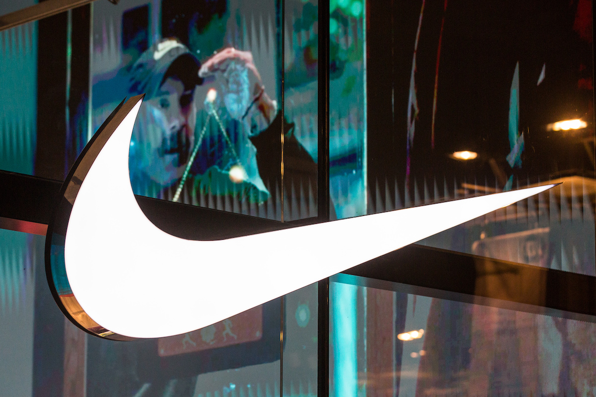 ANTWERP, BELGIUM - 2024/02/15: Illuminated trademark of the American athletic footwear and apparel corporation Nike, Inc. seen on the Nike Store window in Antwerp, Belgium. (Photo by Karol Serewis/SOPA Images/LightRocket via Getty Images)