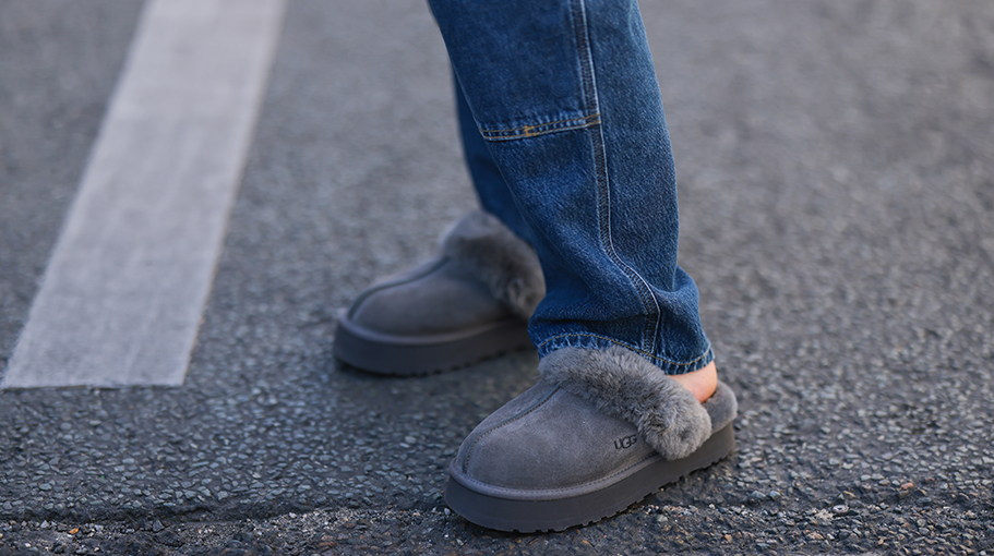 Veronika Heilbrunner seen wearing a dark blue denim jeans pants, and grey charcoal suede UGG Disquette slipper shoes, during Paris Fashion Week - Haute Couture Fall Winter 2022 2023, on July 06, 2022 in Paris, France. (