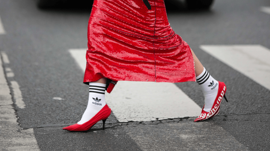 woman wearing red heels and adidas socks