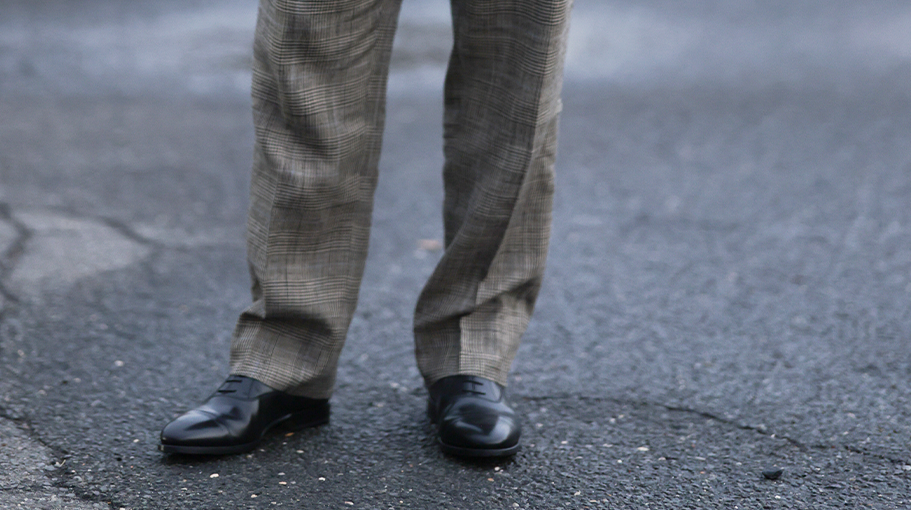 man wearing oxford shoes and dress pants