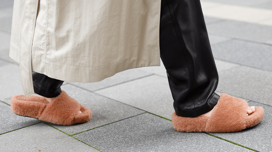 woman walking in pink furry slippers