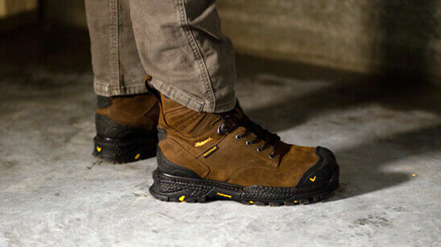 man wearing comfortable work boots on concrete floor