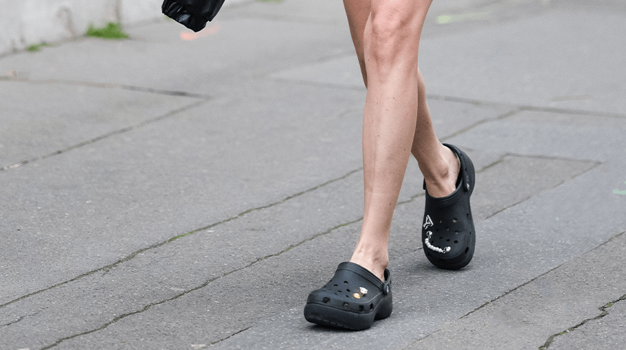 woman wearing black crocs